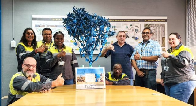 The reach of the Blue Trees are stretching far and wide. Now our mission to break the stigma of mental health has reached the shores of South Africa! 💙⁠
⁠
At Hillside Aluminium, in Richards Bay, colleagues came together to talk about mental health issues in the workplace. Each person then received a blue flower to add to their office tree. We love seeing how communities have created their own spin on the blue tree.⁠