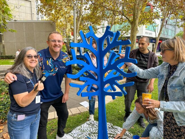 Sometimes, all it takes is one person to start a conversation 💬⁠
⁠
At Synergy HQ Perth, Team Leader Jason invited his team to paint a Blue Tree - and it sparked something special.⁠
⁠
Team members opened up, shared personal stories and embraced vulnerability in the workplace, creating a space where connection replaced silence. ⁠
⁠
Synergy's Blue Tree now stands as a daily reminder to ask yourself and your colleagues the important questions.⁠

@synergyenergy 
⁠
📍Perth, WA⁠
⁠
#bluetreeproject #bluetree #mentalhealth #mentalhealthawareness #conversation #kickthestigma #synergy #perth #perthcity